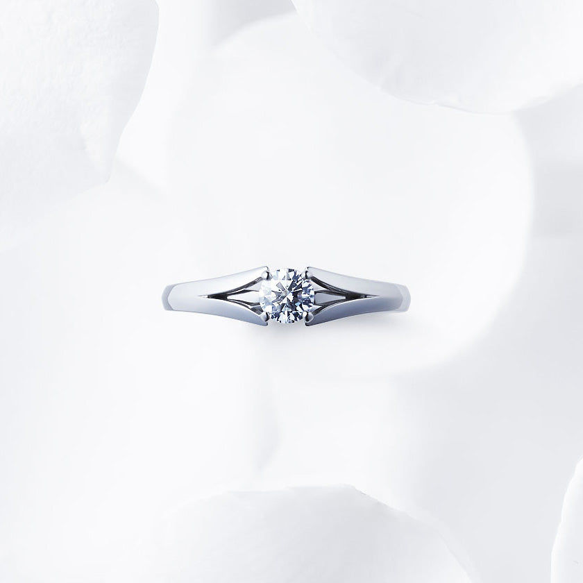 Shown with a 0.34 ct sample diamond.