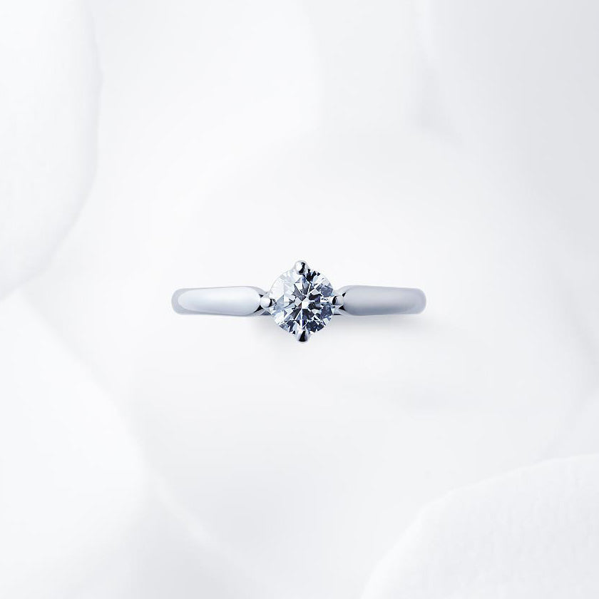 Shown with a 0.51 ct sample diamond.