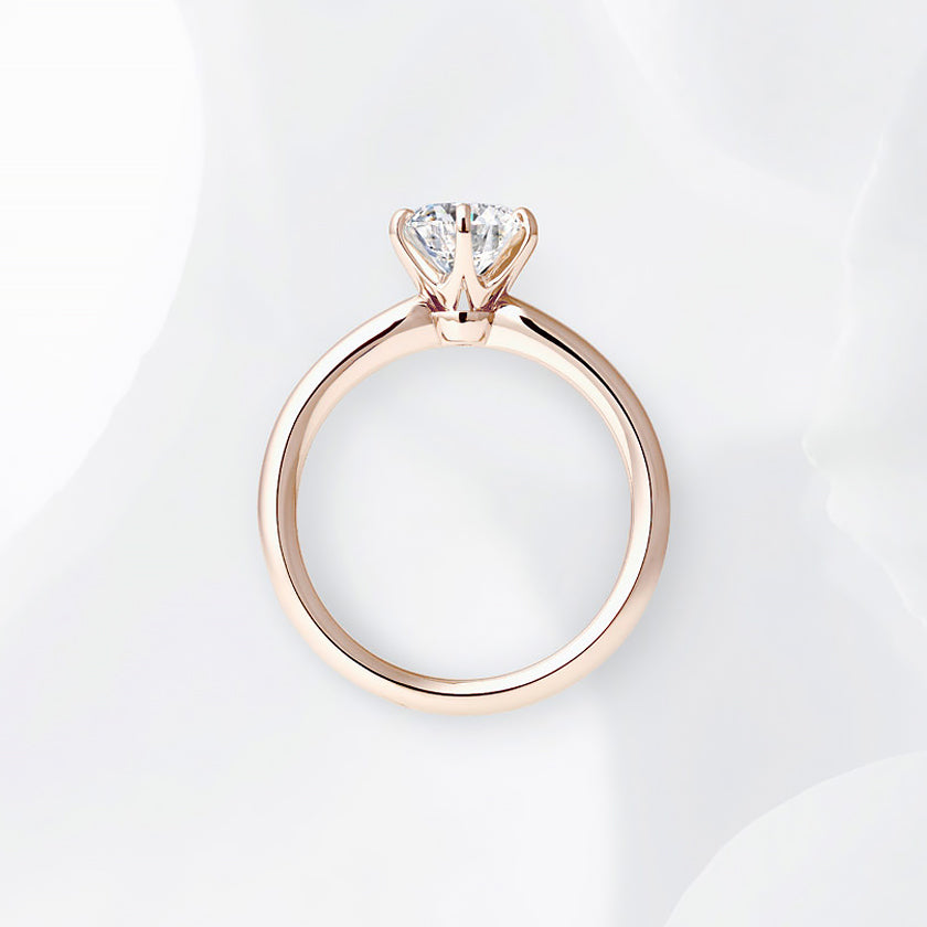 Shown with a 1.09 ct sample diamond.