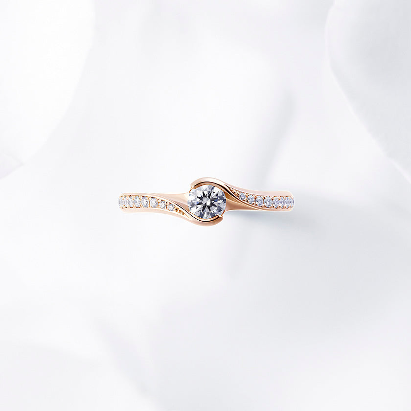 Shown with a 0.26 ct sample diamond.