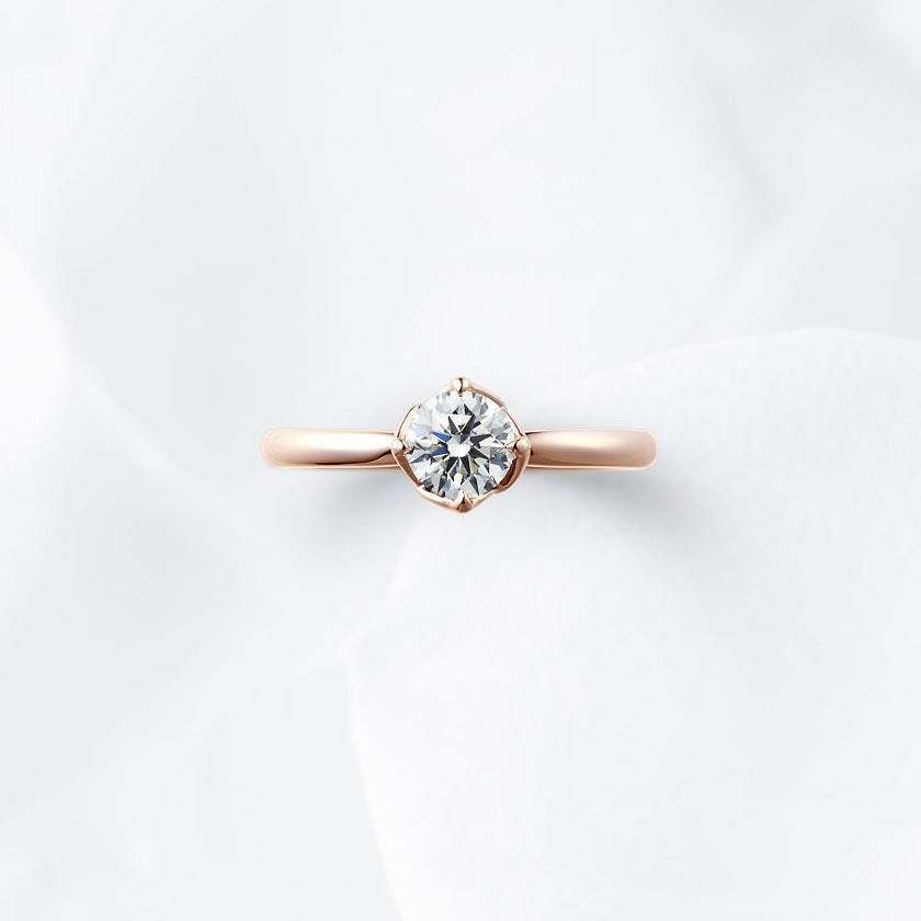 Shown with a 0.54 ct sample diamond.