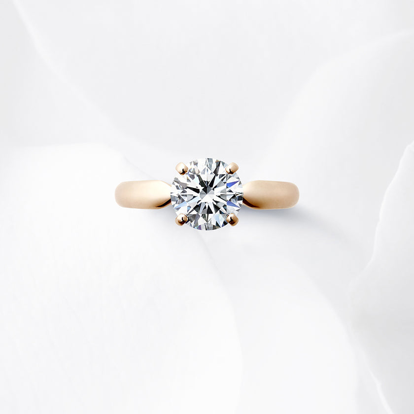 Shown with a 1.55 ct sample diamond.