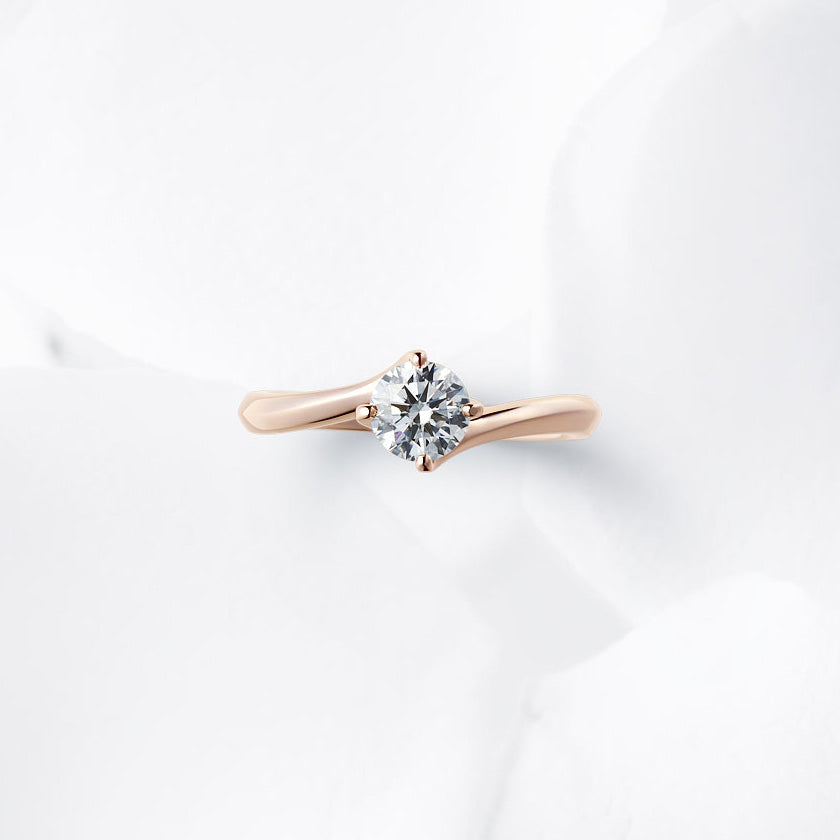 Shown with a 0.56 ct sample diamond.