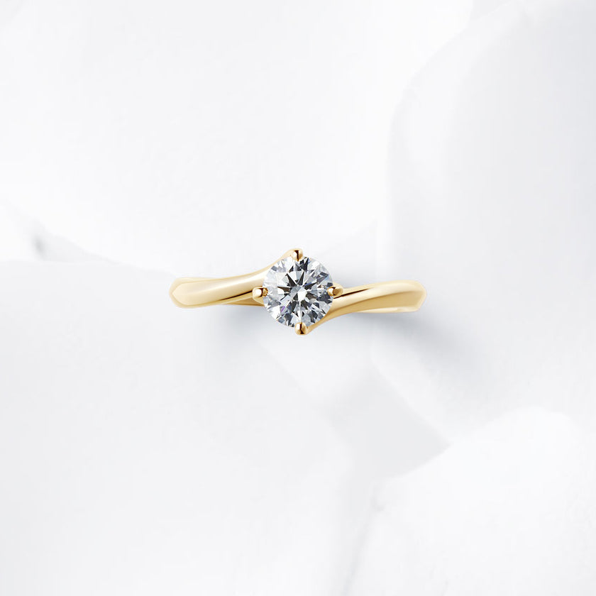 Shown with a 0.56 ct sample diamond.